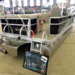 Placement of propeller warning decal on pontoon boat at 2013 Tulsa Boat Show viewed from a distance.