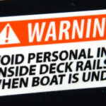 Deck Rails warning, flat label. 2014 Tulsa Boat Show.